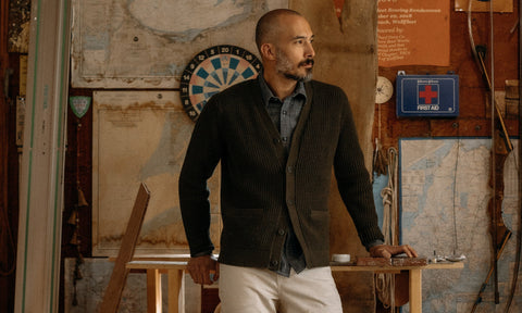 fit model posing in The Mariner Cardigan in Heather Loden Slub