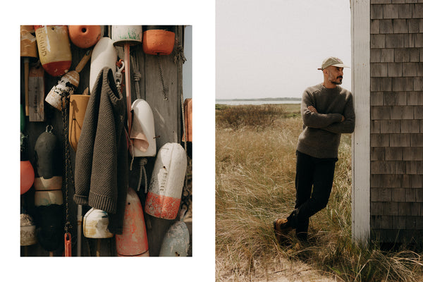 fit model sitting wearing The Fisherman Sweater in Heather Loden Merino