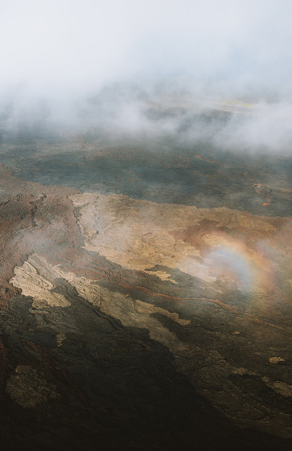 Abstract shot of sunlight reflecting and refracting on misty lava fields.