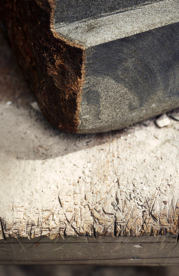 editorial image of stone and wood carvings