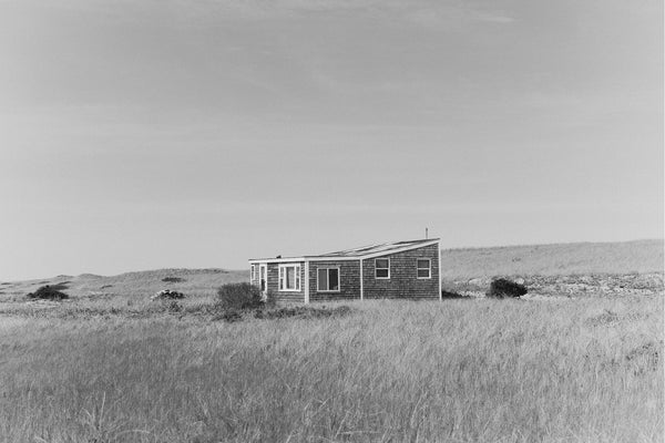 A weathered wooden cabin in Wellfleet, MA