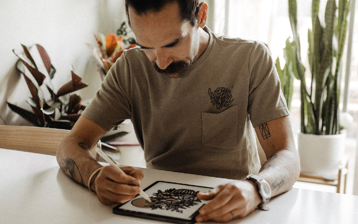 Daren Magee wearing The Heavy Bag Graphic Tee in Sage Dahlia