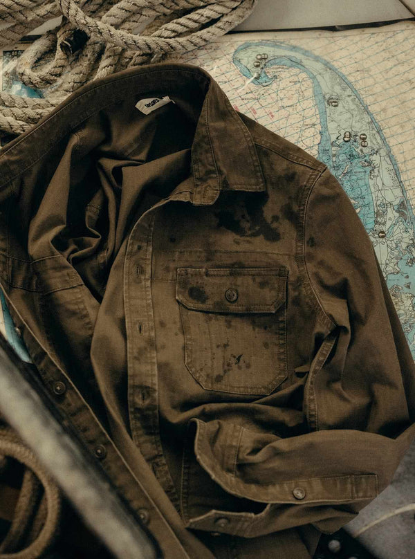 The Field Overshirt in Mushroom Ripstop with droplets on its surface
